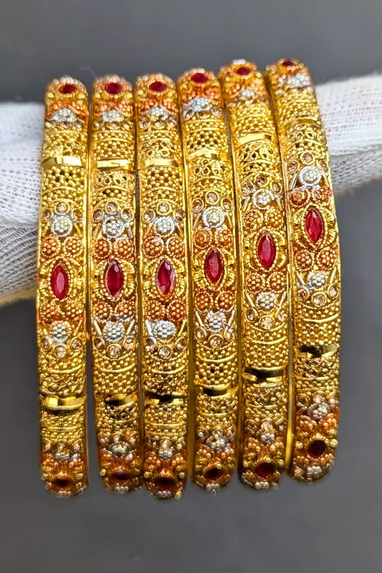 Luxurious Golden Bangles with Red Pearls