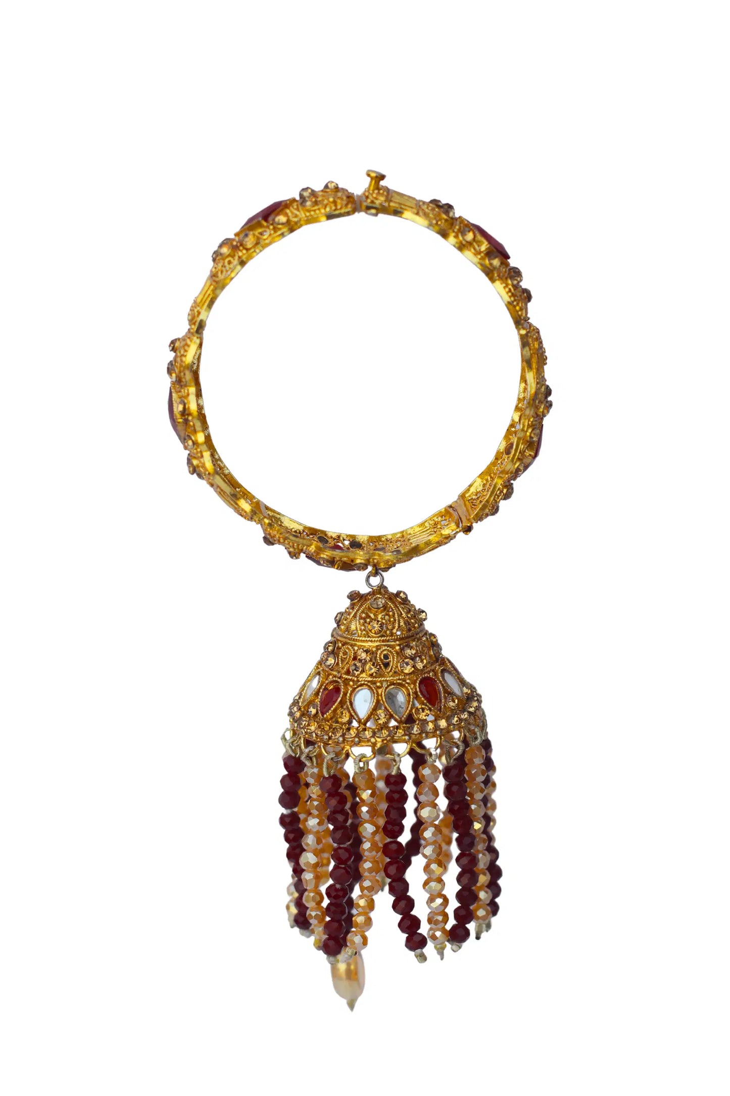 Gold bracelet with red and white bead tassels on a white background