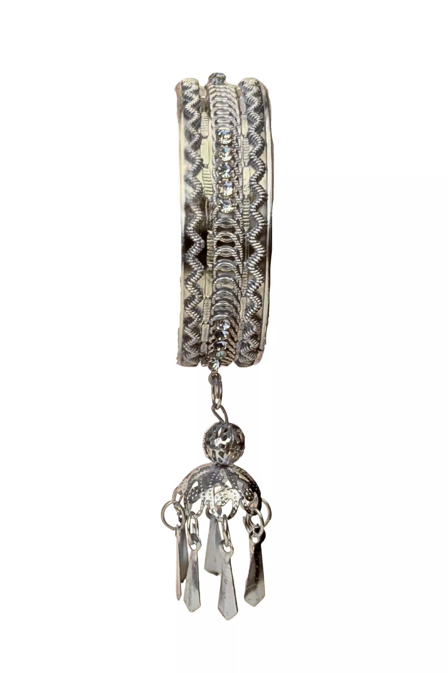 Decorative silver bracelet with a dangling charm on a white background