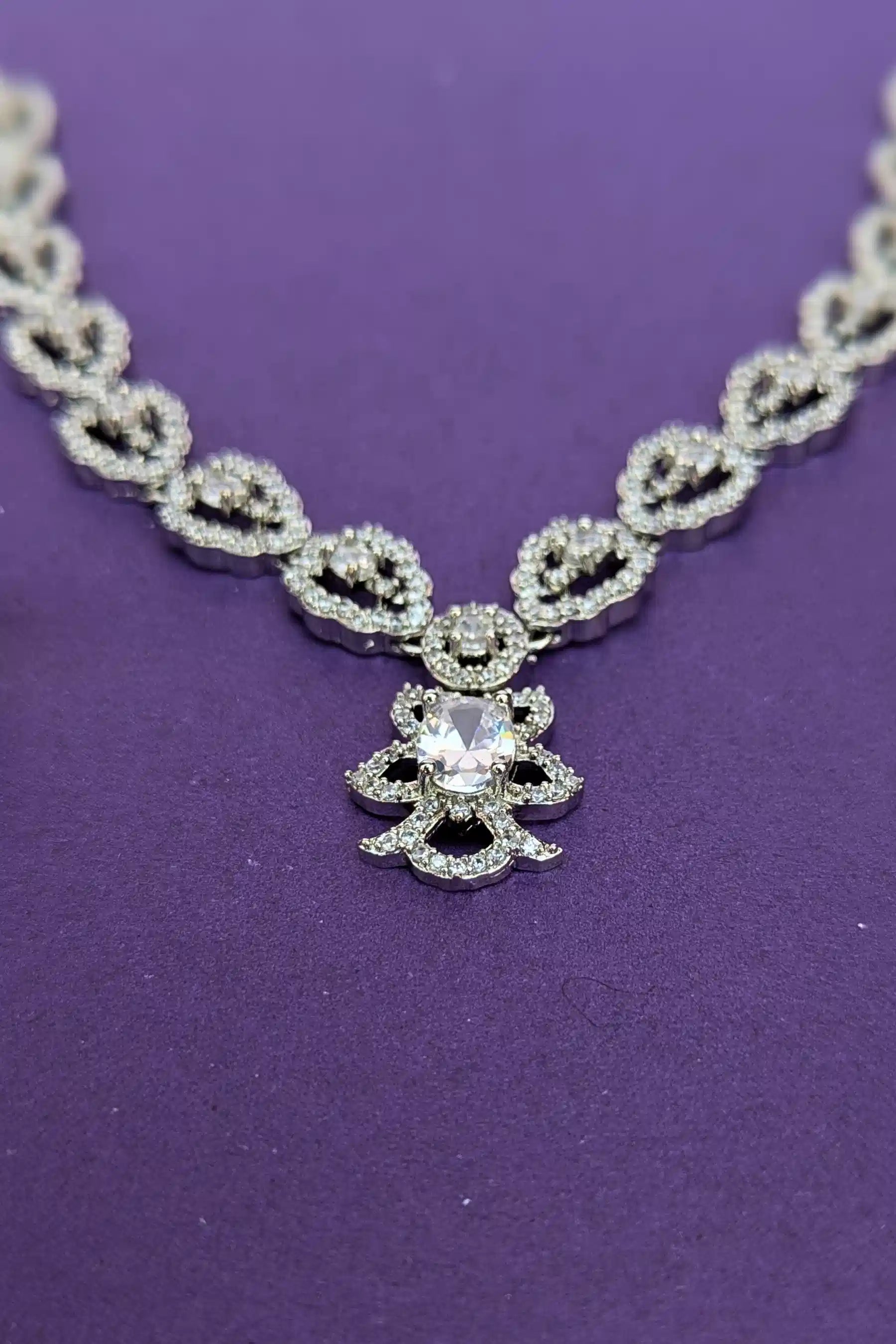 Elegant diamond necklace on a purple background