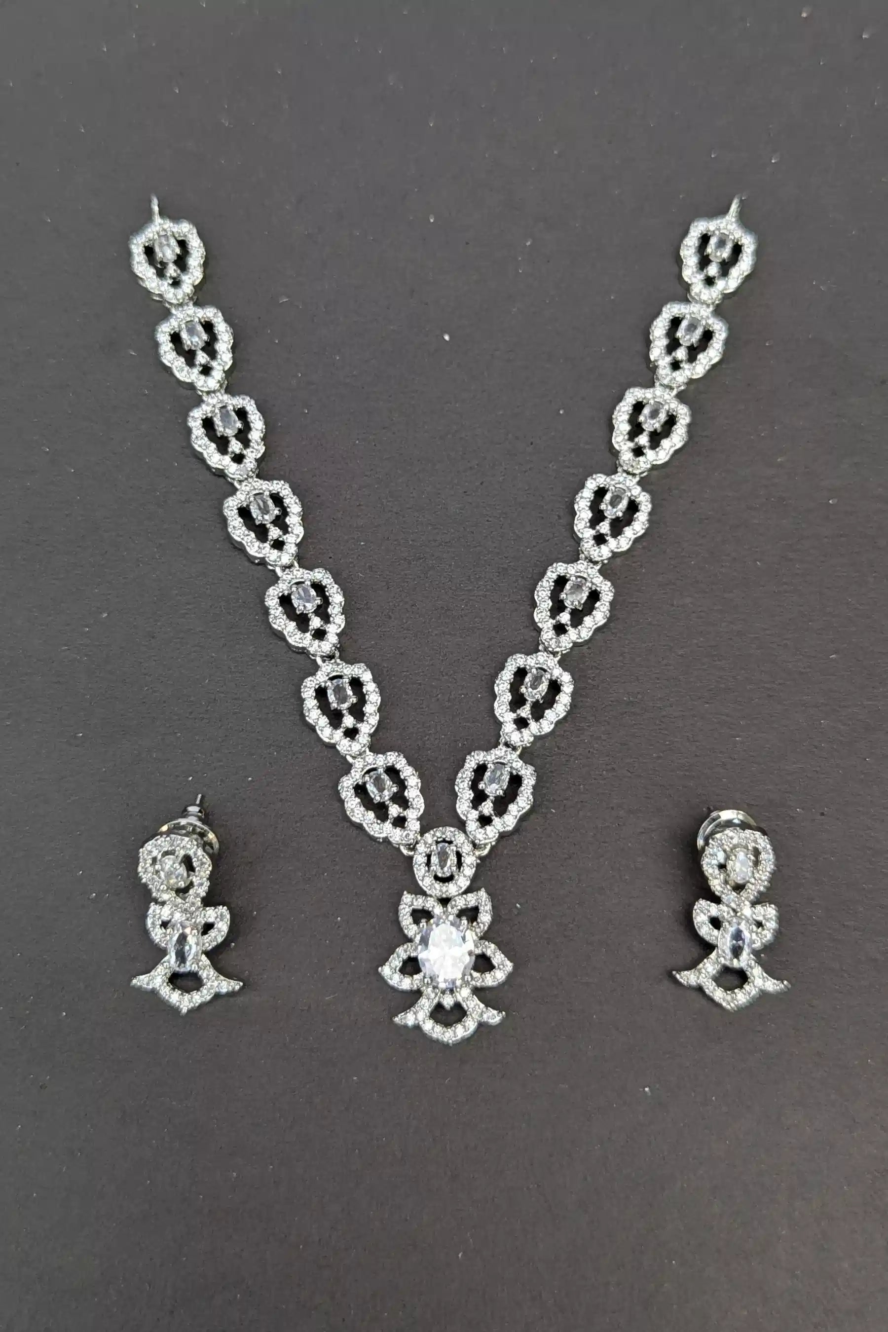 Jewelry set with necklace and earrings on a dark background