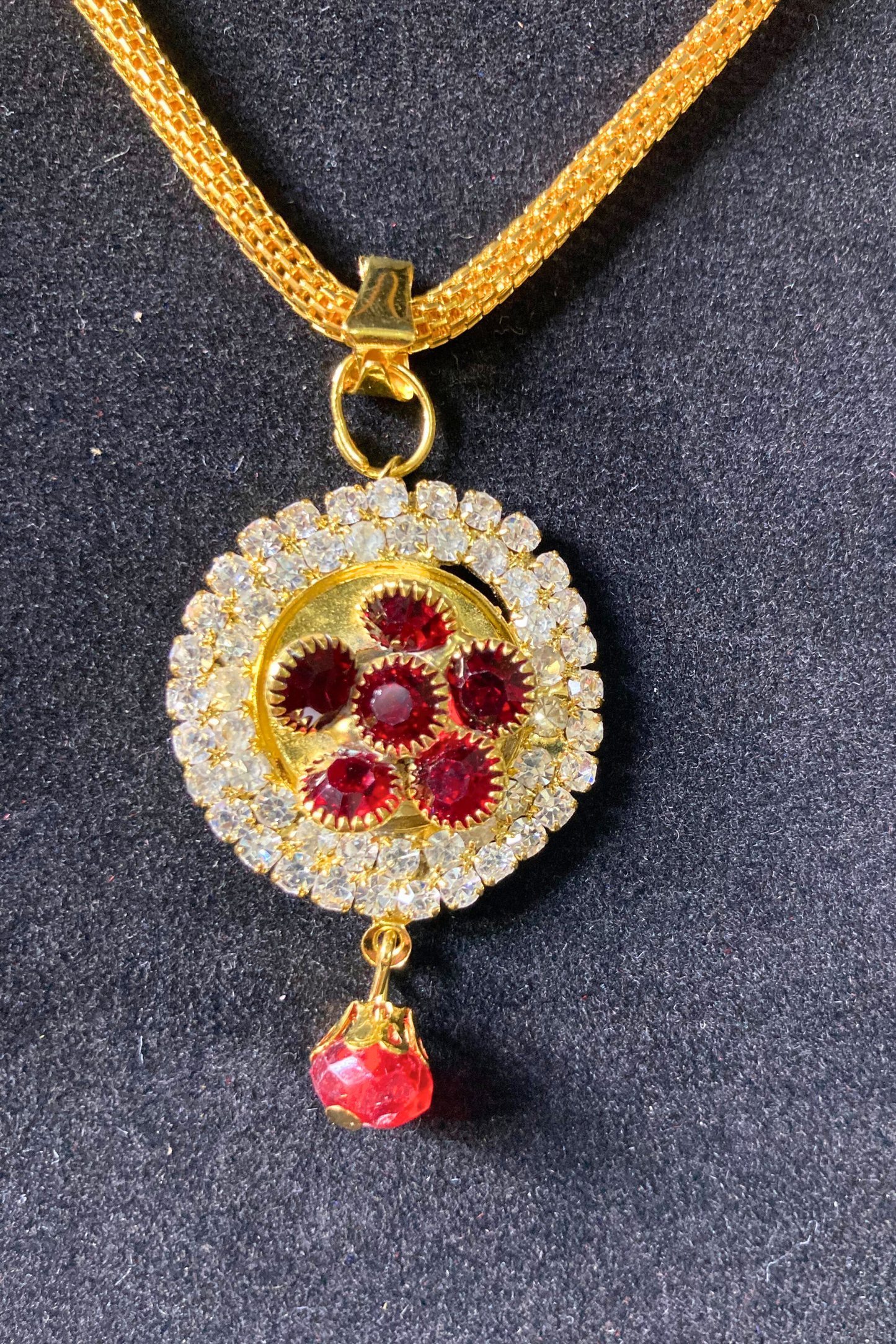 Golden Pendant Necklace and Earrings Set with Red Stone Accents