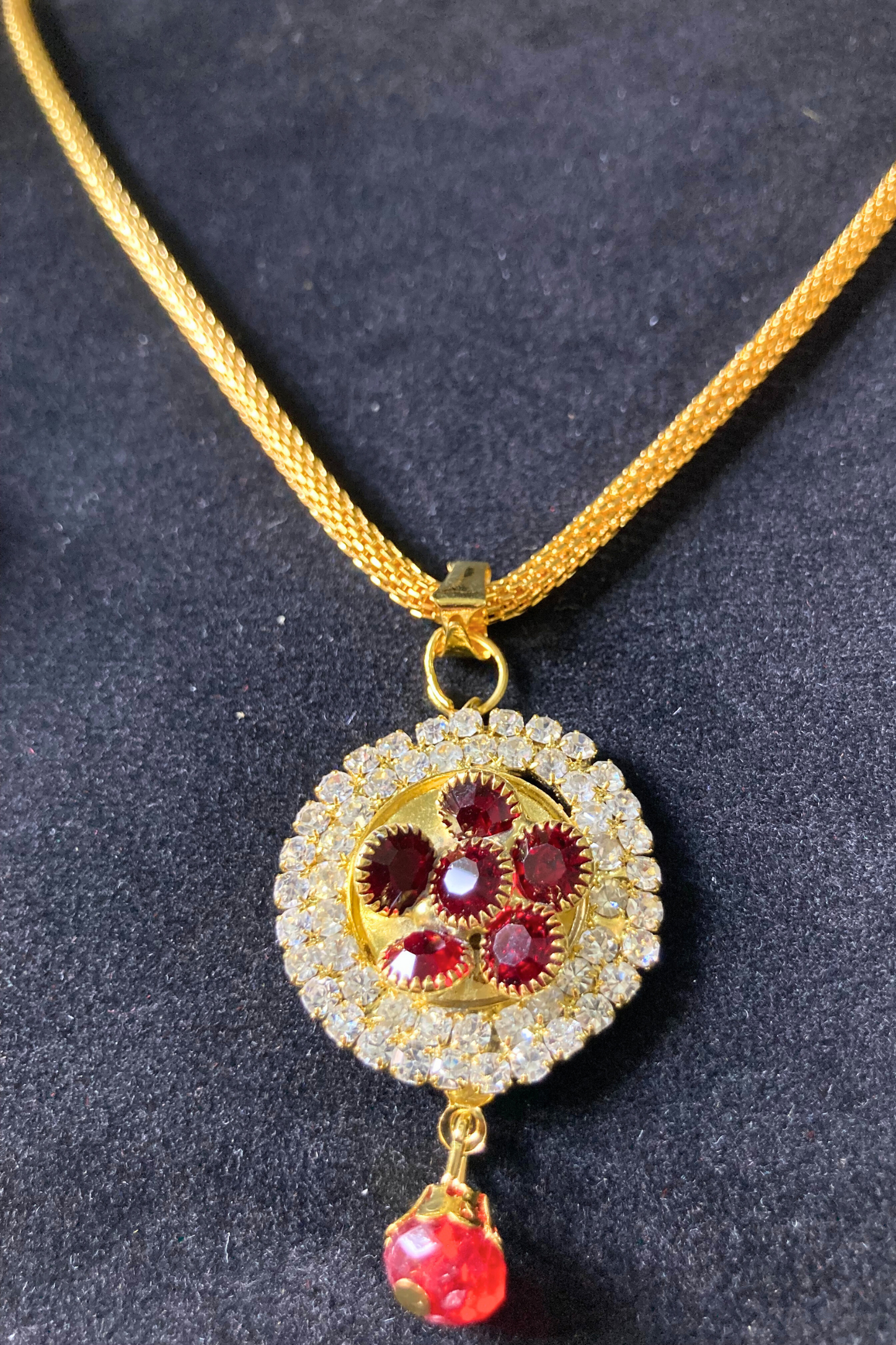 Golden Pendant Necklace and Earrings Set with Red Stone Accents