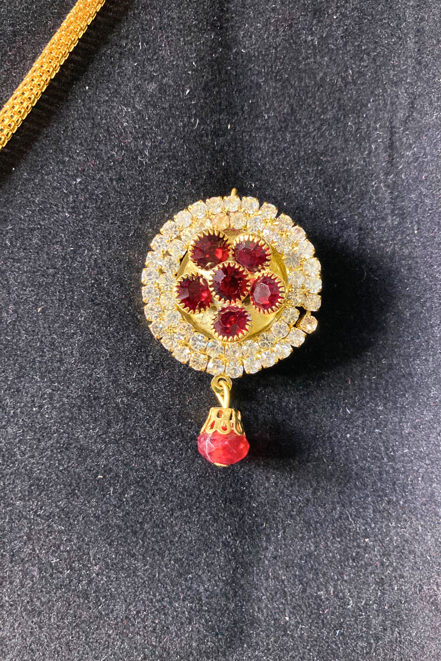 Golden Pendant Necklace and Earrings Set with Red Stone Accents