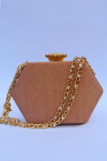 Brown handbag with gold chain on a light blue background