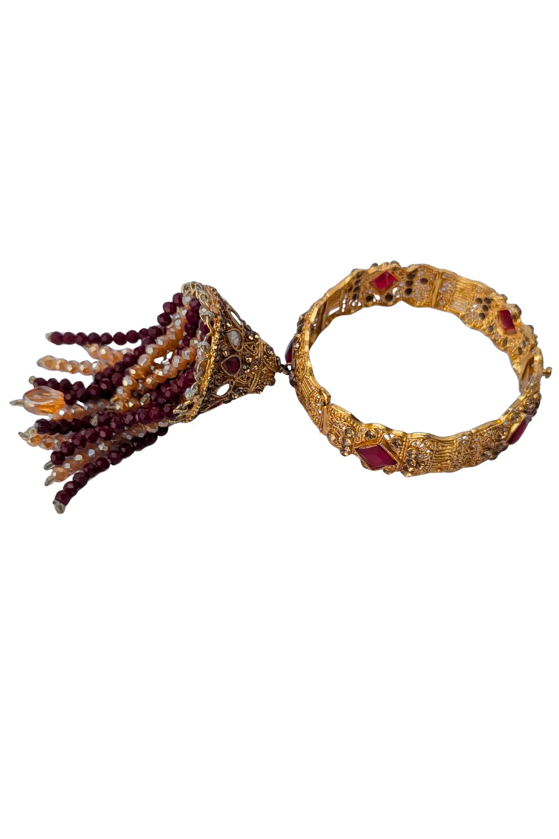 Decorative bracelet with tassel on a white background