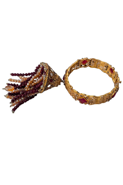Decorative bracelet with tassel on a white background