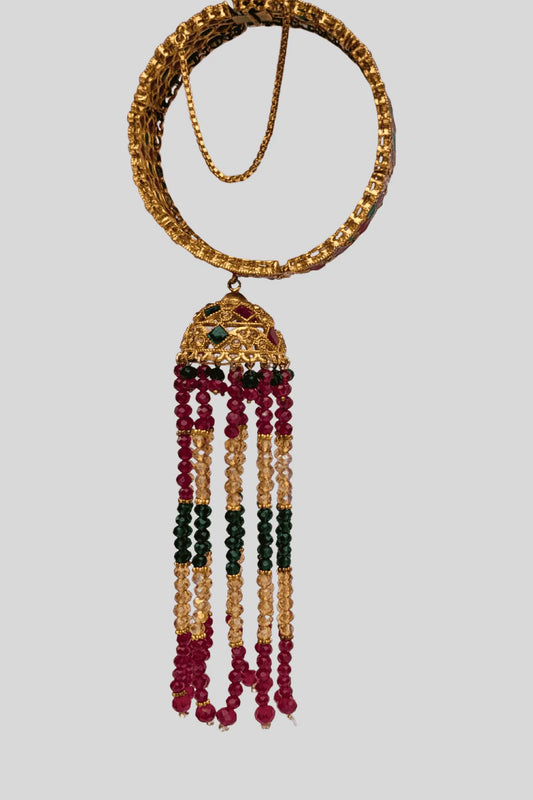 Decorative bracelet karra with beads on a light gray background