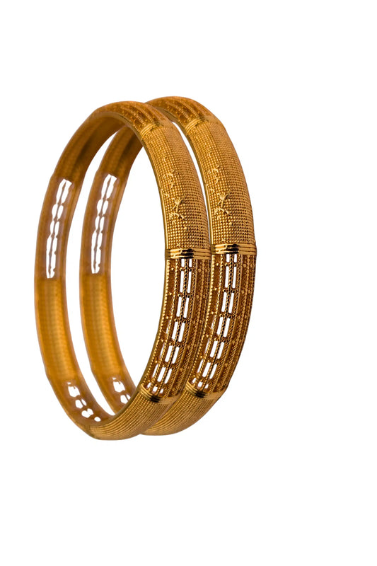 Two gold bangles with intricate designs on a white background