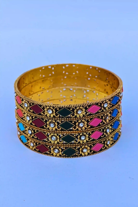 Decorative bangles with colorful stones on a blue background
