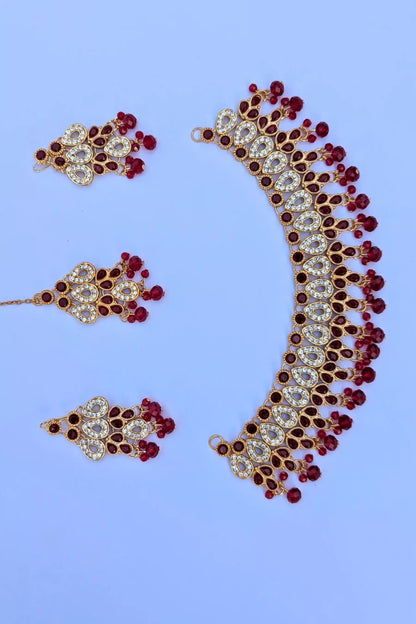 Jewelry set with necklace and earrings on a light blue background