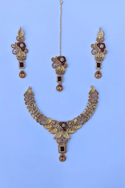 Jewelry set with necklace, earrings, and ring on a light blue background