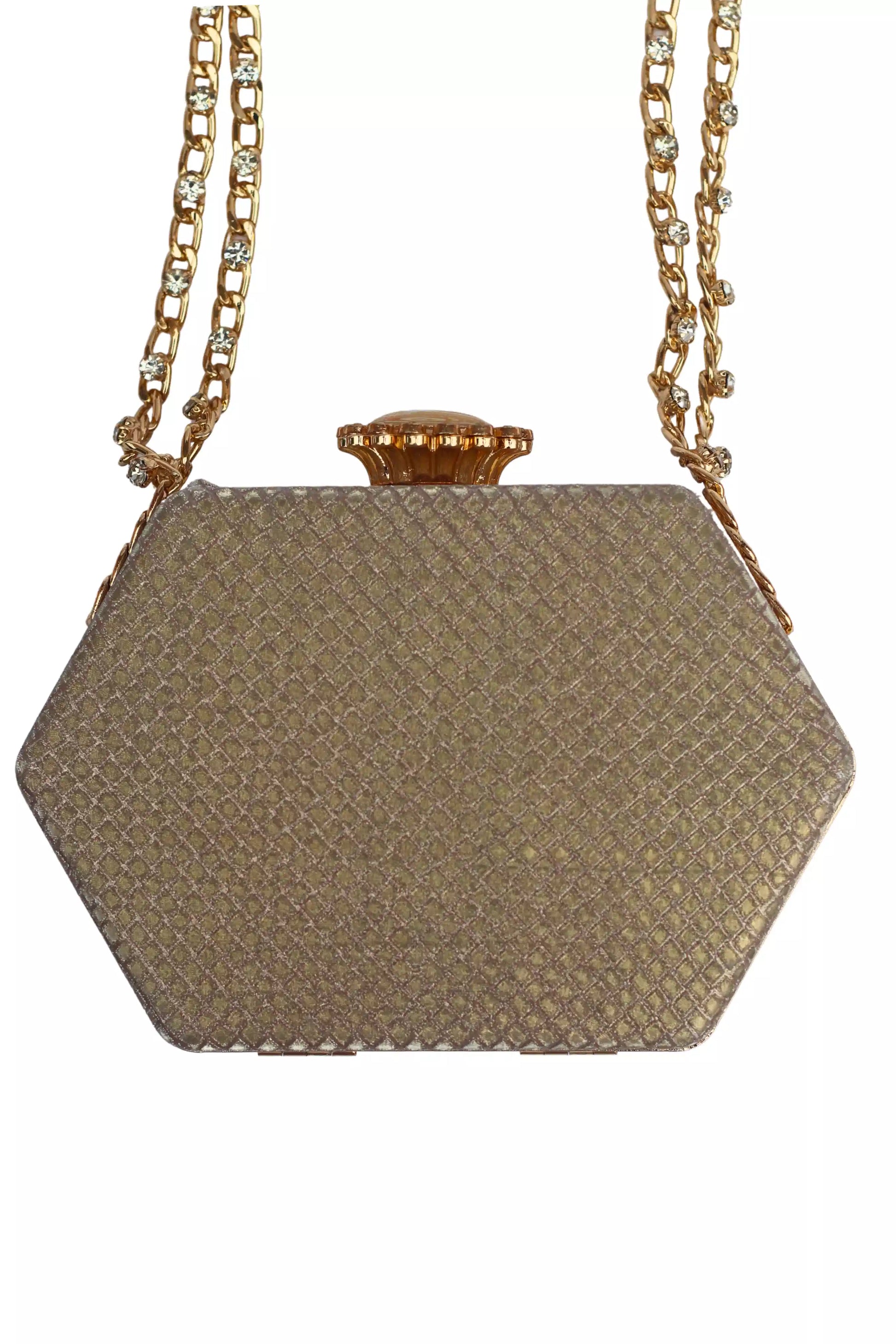 Hexagonal gold clutch bag with a chain strap on a white background