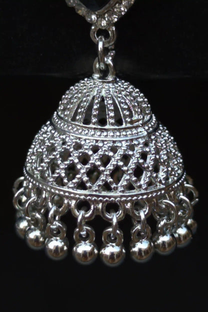 Silver jhumka pendant on a black background