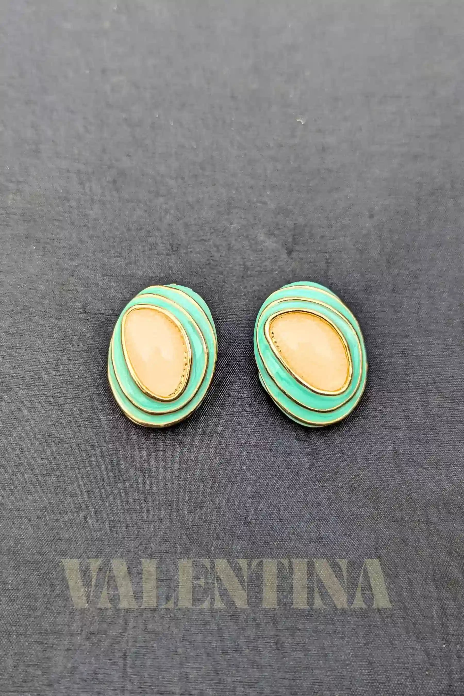 stud earrings in green color
