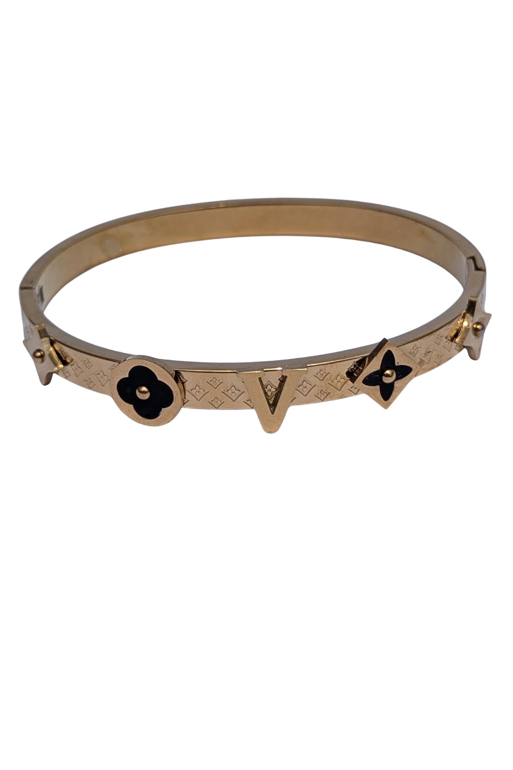 Gold bracelet with black butterfly charms on a white background