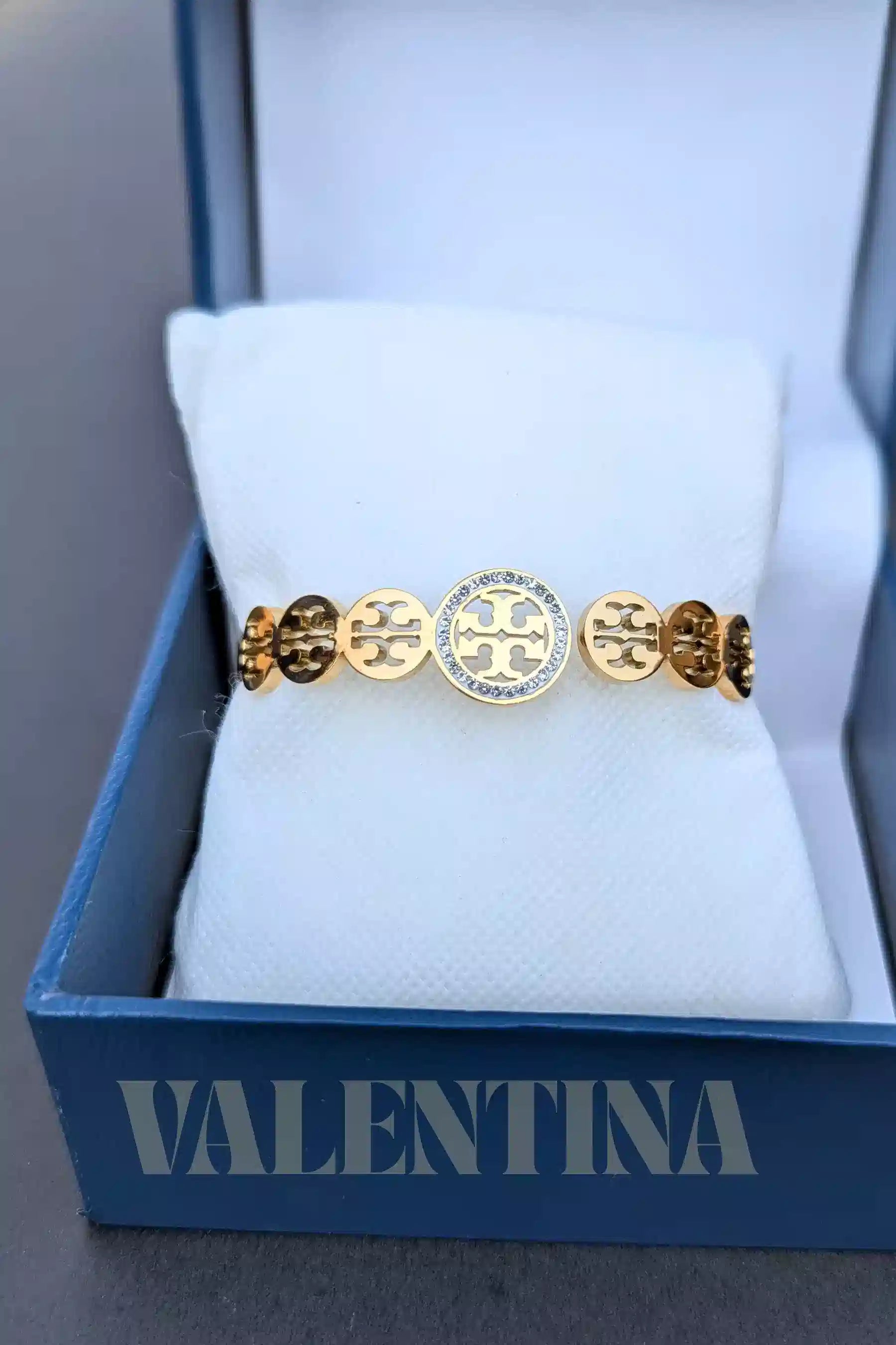 Gold bracelet with circular designs in a 'Valentina' box